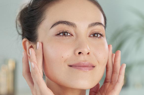 Woman putting on cream